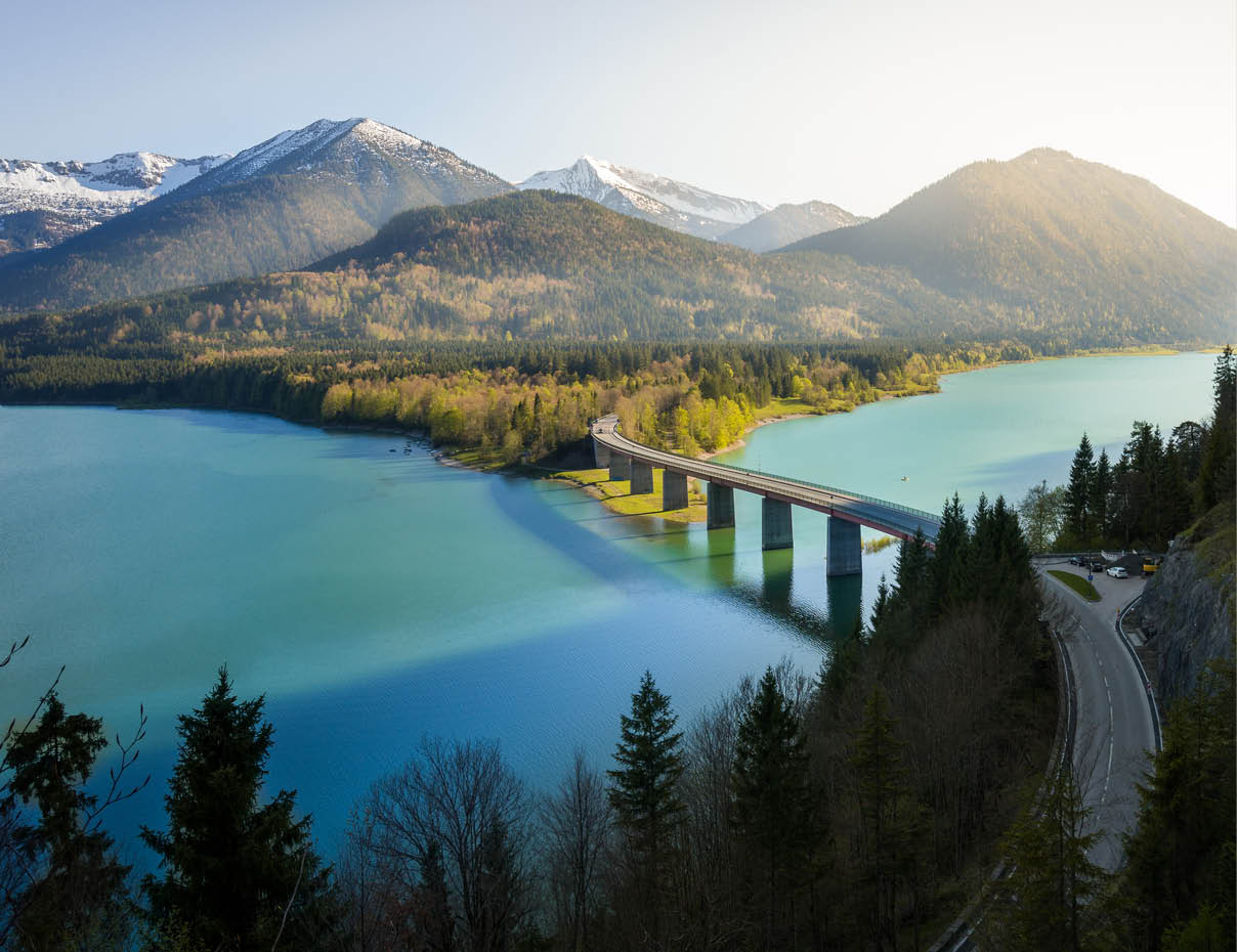 The last sun rays hit the mountains of lake Sylvensteinspeicher, Upper Bavaria, Germany, Europe.