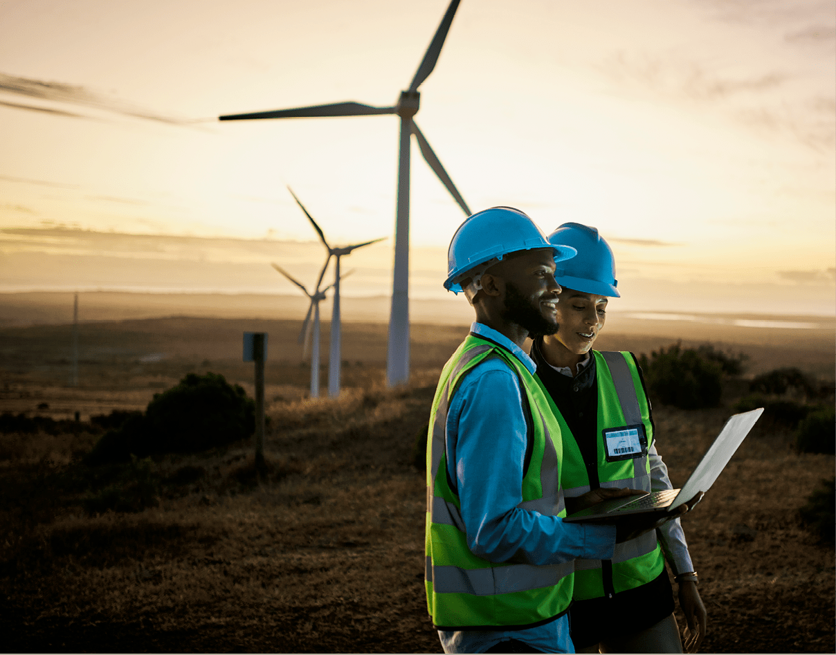 Laptop, farm and engineer team together at night for renewable energy, power and wind turbine. Electrician or technician man and woman in nature for electricity, eco and green environment maintenance